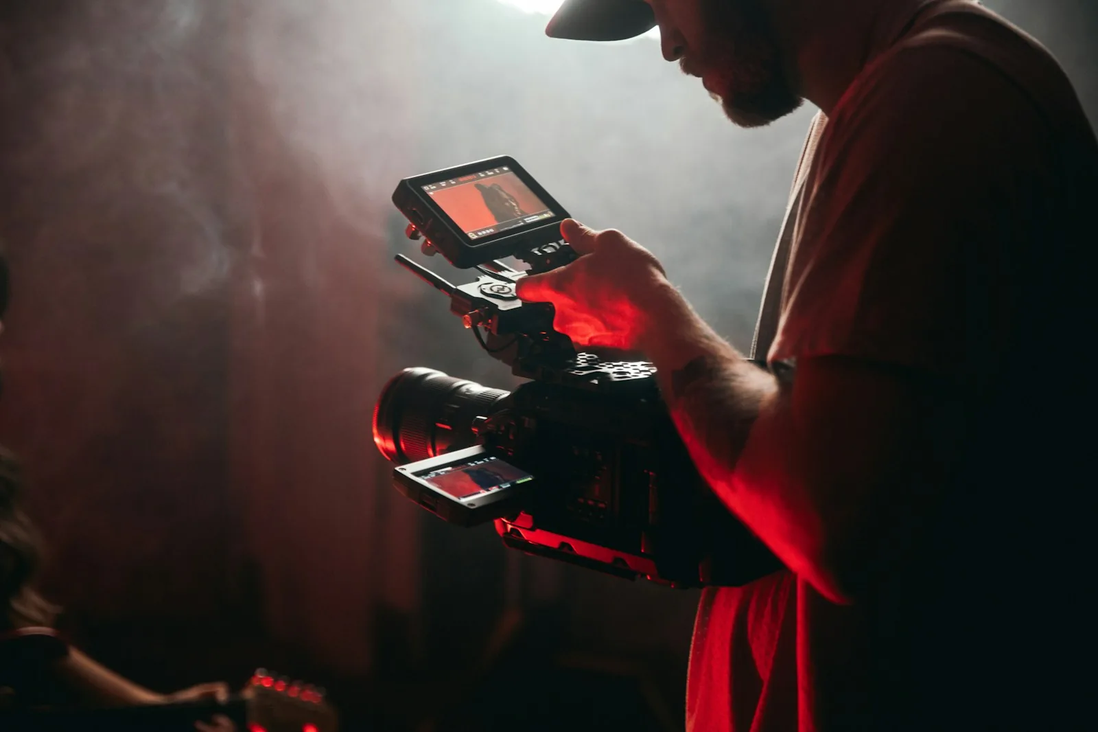 Videographer filming on a cinema camera